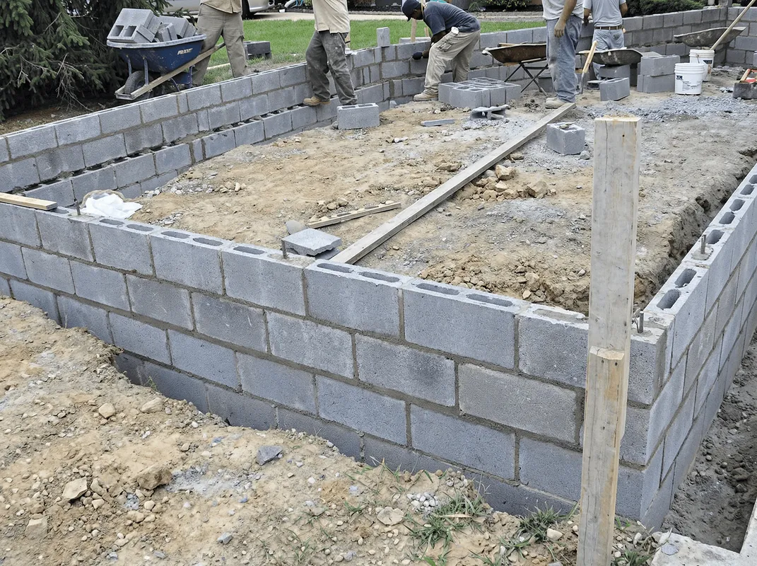 Professionals building a foundation with blocks in Jersey City, NJ