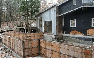 Prepared site with foundation forms for home remodeling and addition project in Jersey City, NJ